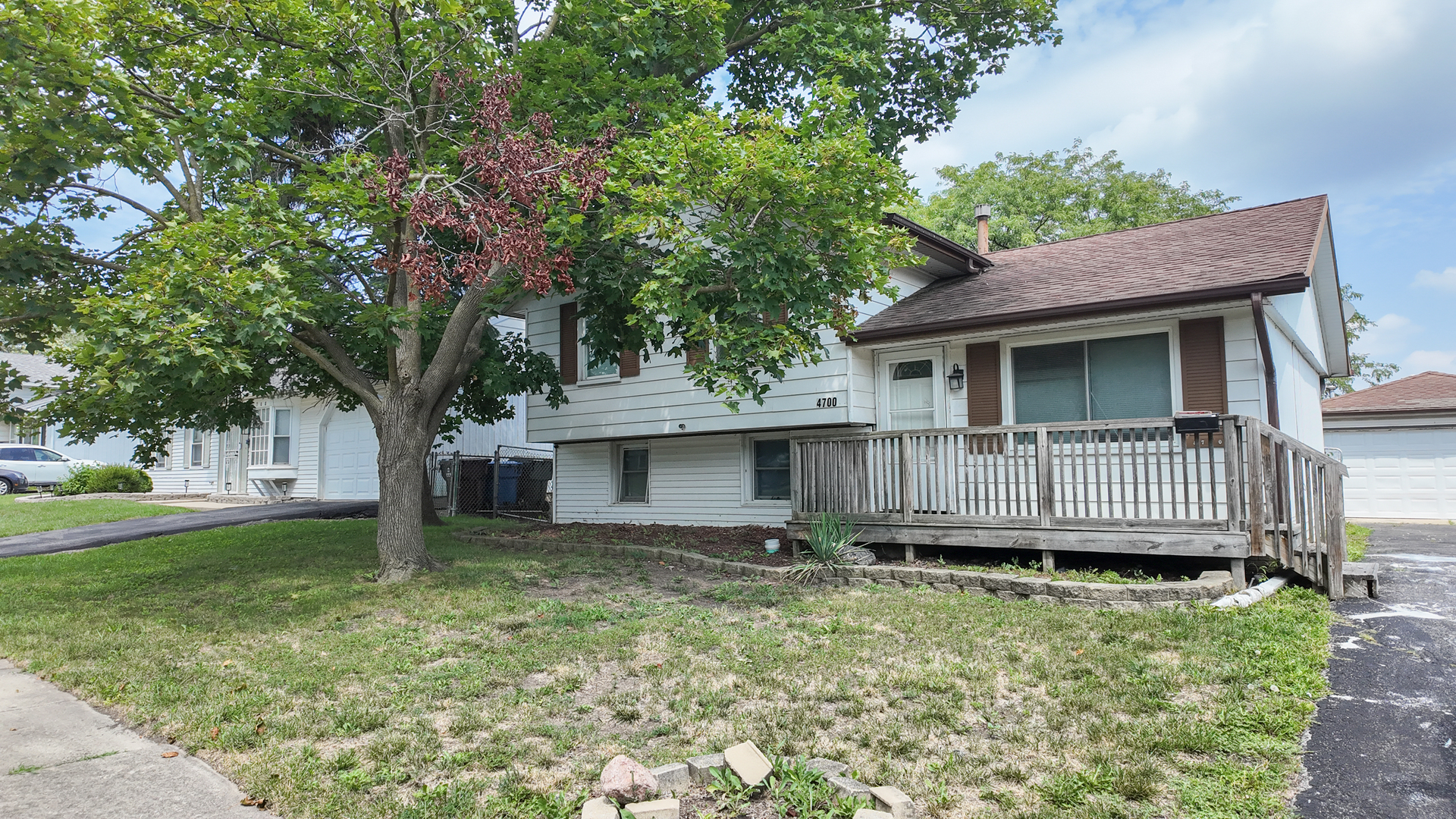 a view of a house with a yard and plants