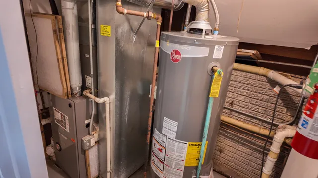 a bathroom with a toilet and a mirror