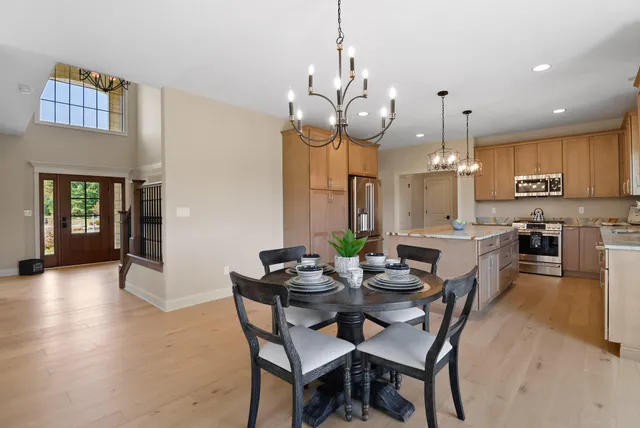 a view of a kitchen with a sink stainless steel appliances and cabinets