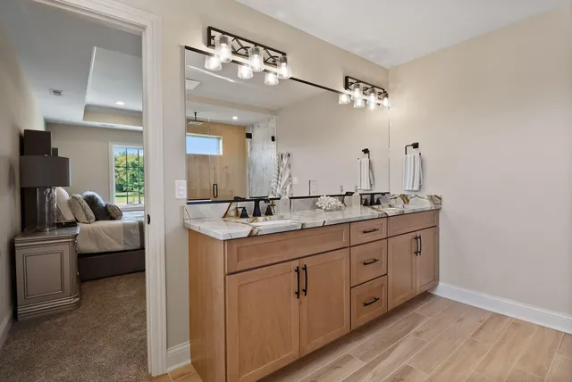 a bathroom with a sink a toilet and bathtub