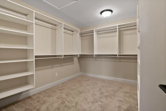 a view of wooden deck with a lake view