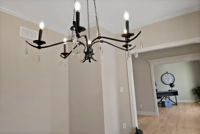 a large kitchen with a table and chairs in it
