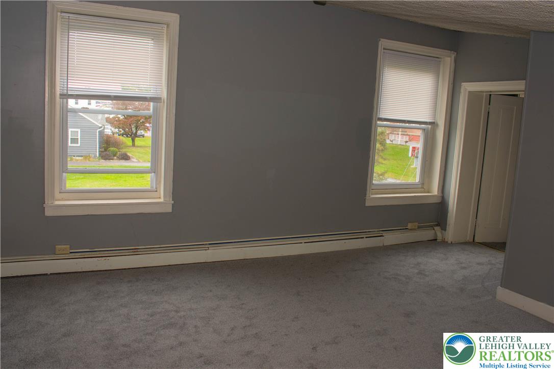 3914 Mauch Chunk Road Coplay, PA 18037 - Photo 8 of 8 an empty room with windows