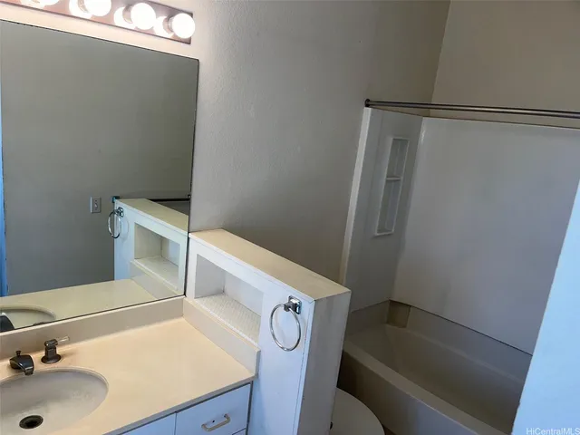 a bathroom with a sink and toilet
