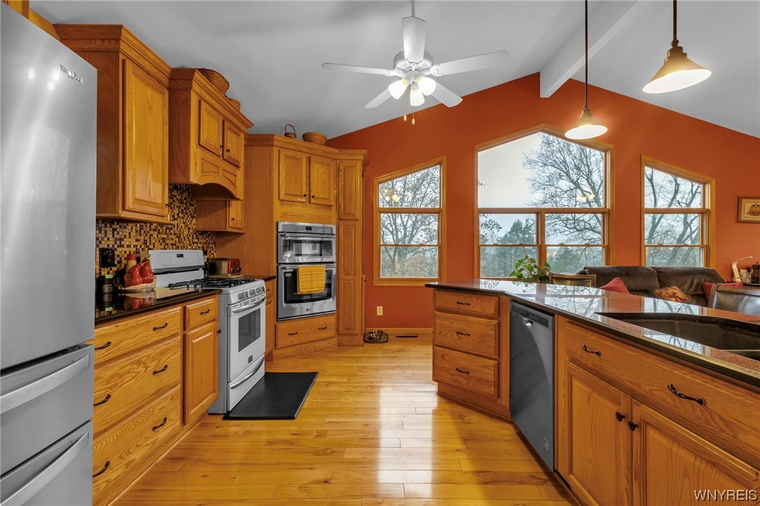 7140 Bear Ridge Road Pendleton, NY 14120 - Photo 15 of 44 Kitchen area with large windows overlooking backya