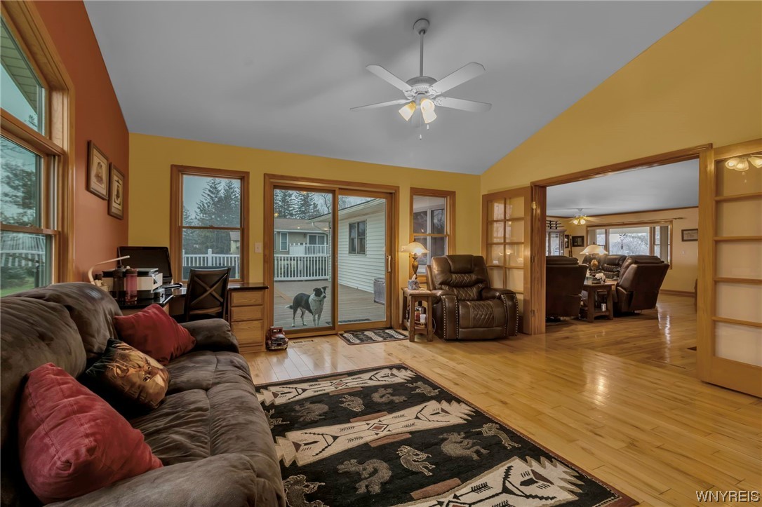 7140 Bear Ridge Road Pendleton, NY 14120 - Photo 20 of 44 Living room with exit to deck- Cute puppy not incl