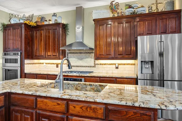 a bathroom with a sink and a large mirror