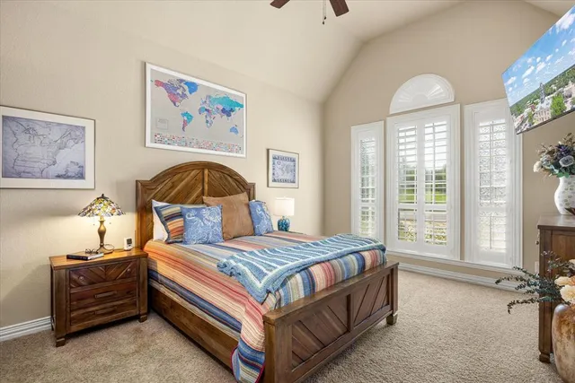 a living room with furniture a ceiling fan and a window