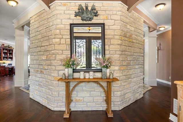 a living room with fireplace furniture and a large window