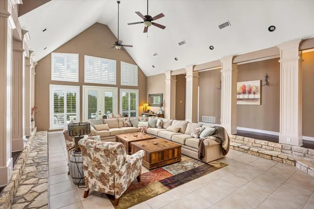 a living room with fireplace furniture and a fireplace