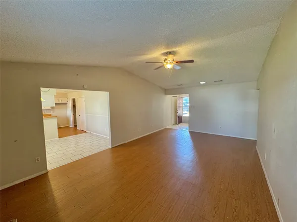 a view of empty room with a bathroom