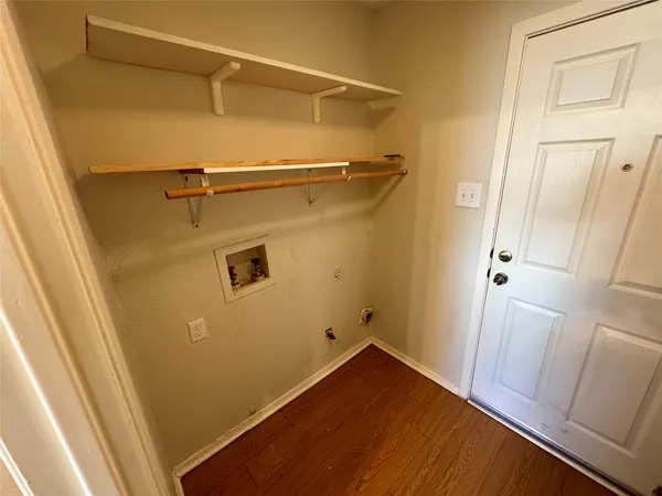 a view of door with wooden floor