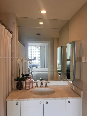 a kitchen with stainless steel appliances granite countertop a sink refrigerator and microwave