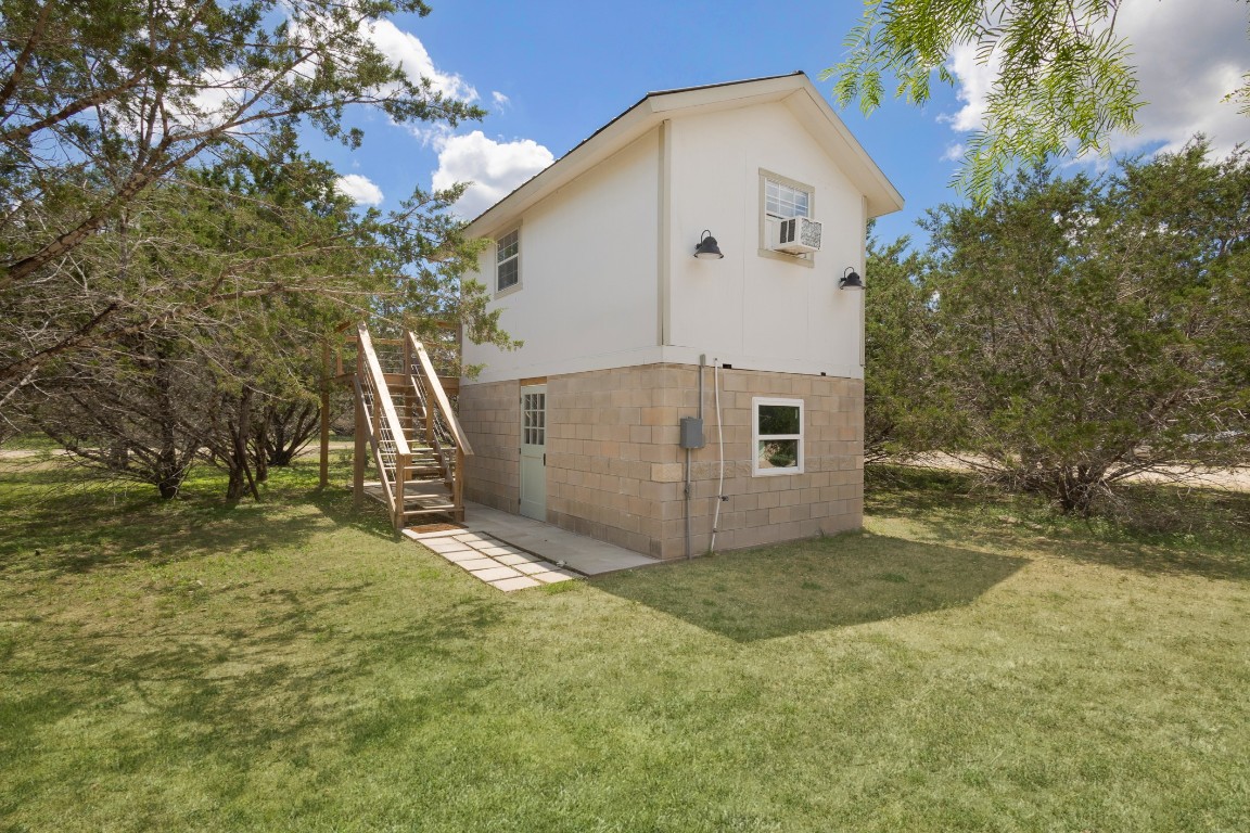 539 Rio Luna Drive Bandera, TX 78003 - Photo 13 of 24 a view of a house with a yard