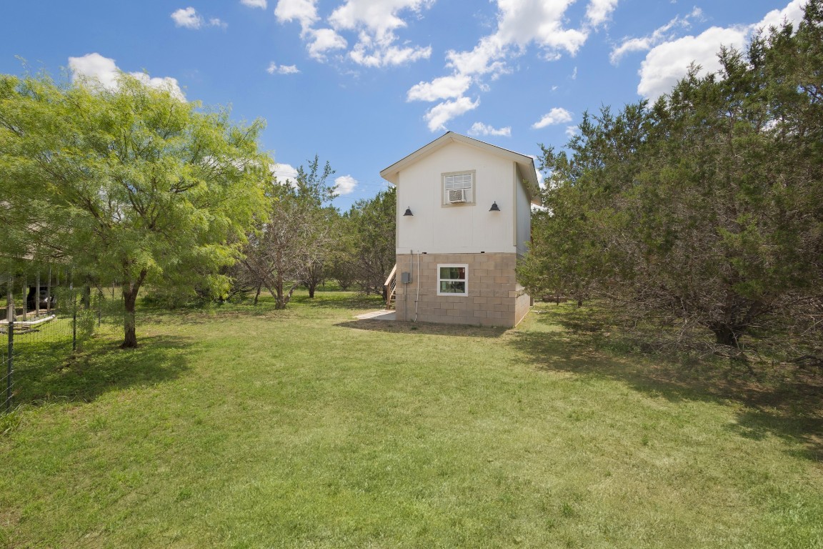539 Rio Luna Drive Bandera, TX 78003 - Photo 14 of 24 a large tree in the middle of a yard