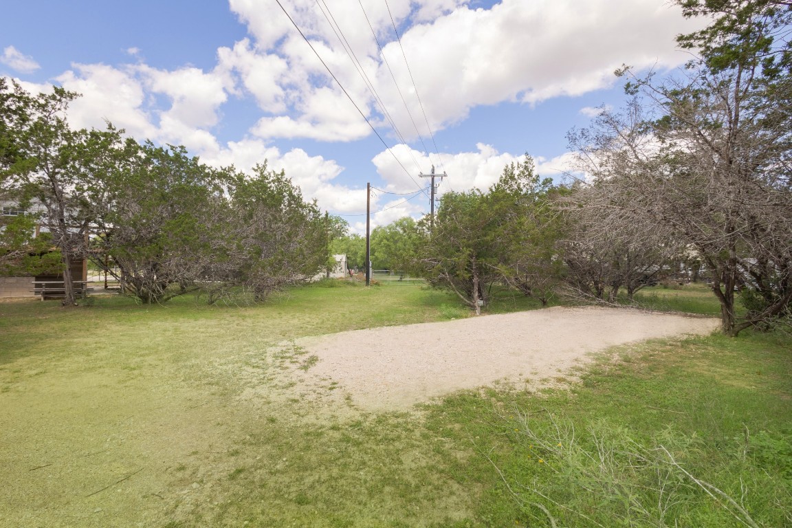 539 Rio Luna Drive Bandera, TX 78003 - Photo 15 of 24 a view of a yard with a house