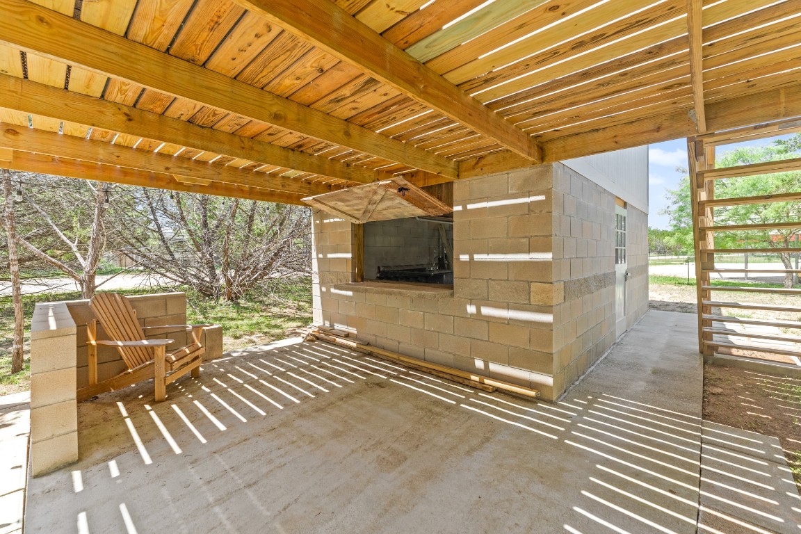 539 Rio Luna Drive Bandera, TX 78003 - Photo 4 of 24 a view of a patio with wooden fence