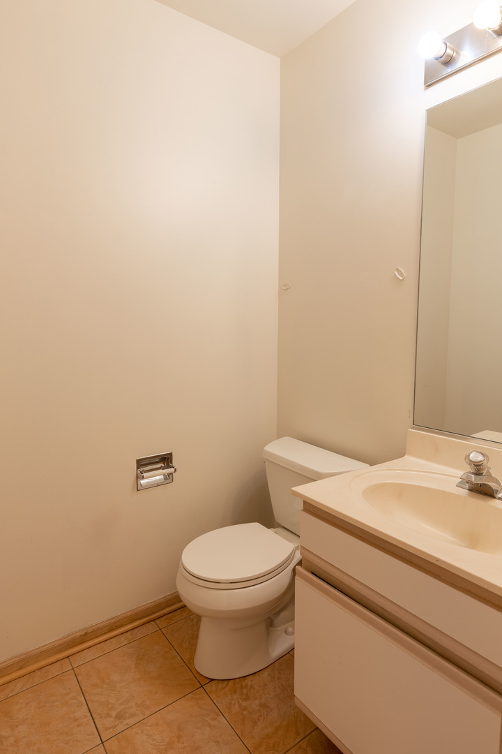643 Maple Drive Streamwood, IL 60107 - Photo 13 of 32 a white toilet sitting next to a white sink