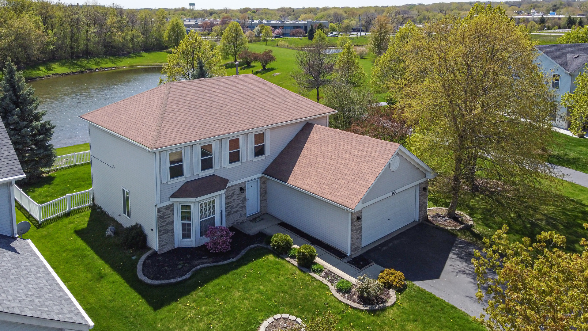 643 Maple Drive Streamwood, IL 60107 - Photo 31 of 32 an aerial view of a house with porch yard basket ball court and outdoor seating