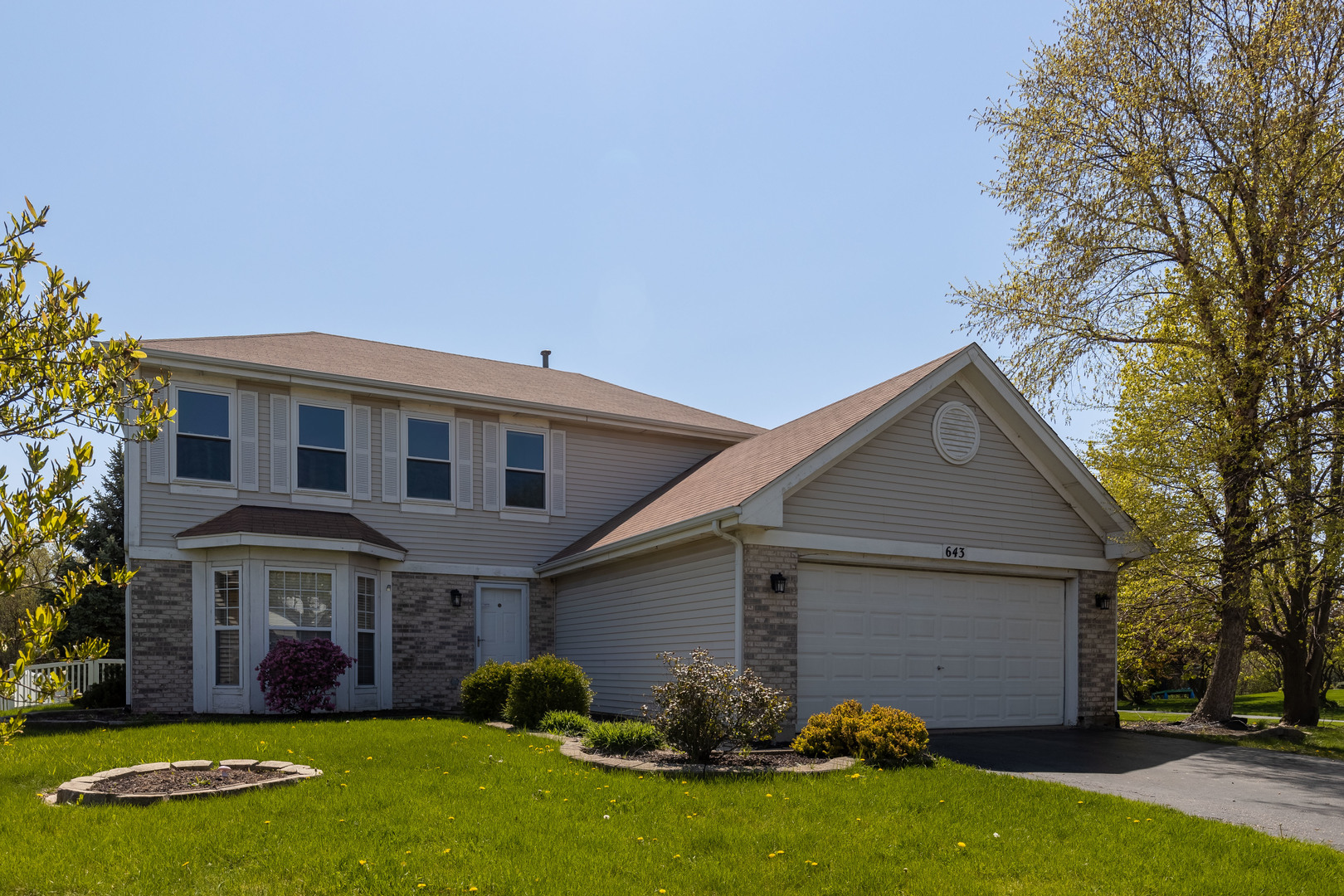 643 Maple Drive Streamwood, IL 60107 - Photo 32 of 32 a view of a yard in front of a house