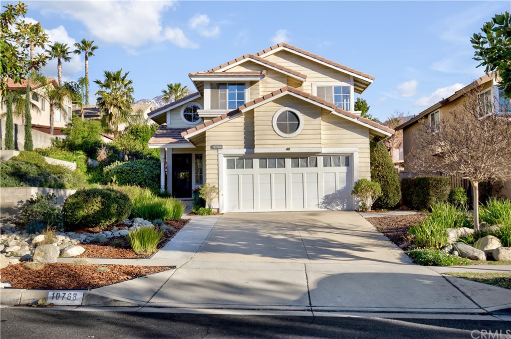 10768 Zinfandel Street Rancho Cucamonga, CA 91737 - Photo 1 of 1 a front view of a house with porch