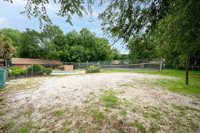 a view of a swimming pool with a yard
