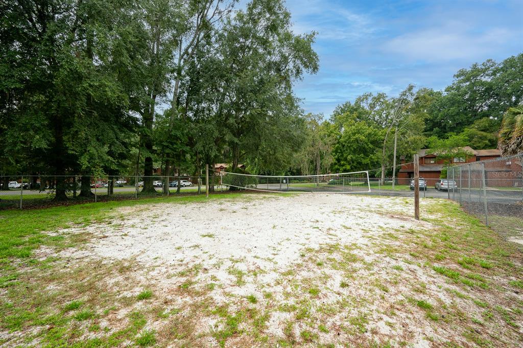 900 Southwest 62nd Boulevard, Unit H49 Gainesville, FL 32607 - Photo 30 of 38 a backyard of a house with lots of green space