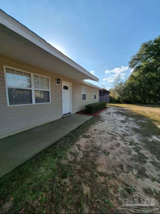 a view of a backyard of the house
