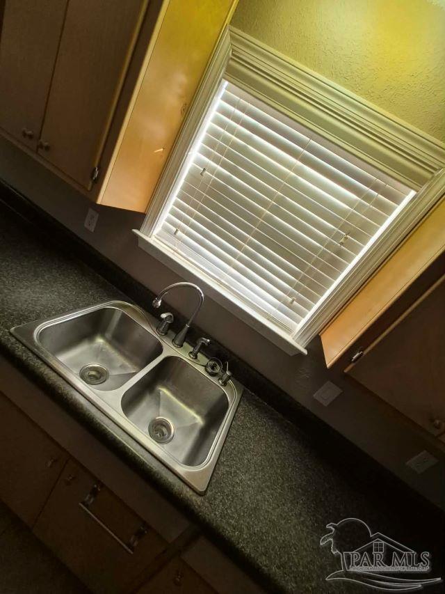 4071 Diamond Street Pace, FL 32571 - Photo 17 of 19 a view of a sink a table and chairs in a balcony