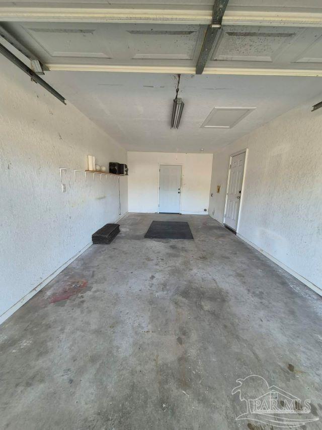 4071 Diamond Street Pace, FL 32571 - Photo 6 of 19 a view of a refrigerator in a room