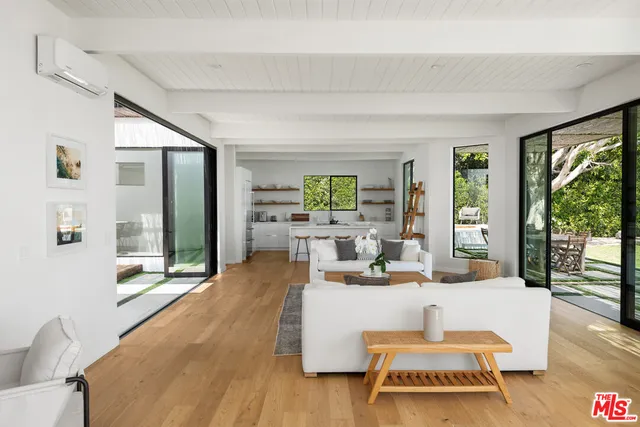 a kitchen with sink a stove and cabinets