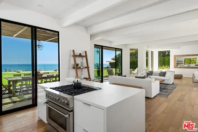 a view of a balcony with hardwood floor