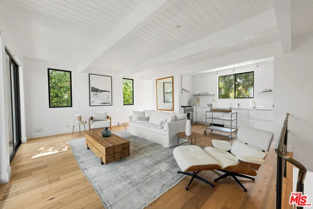 a view of a backyard with sitting area