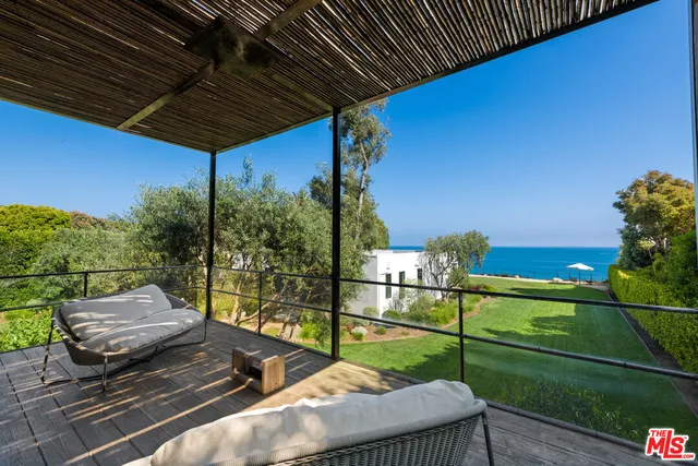 a front view of a house with a yard and a garage