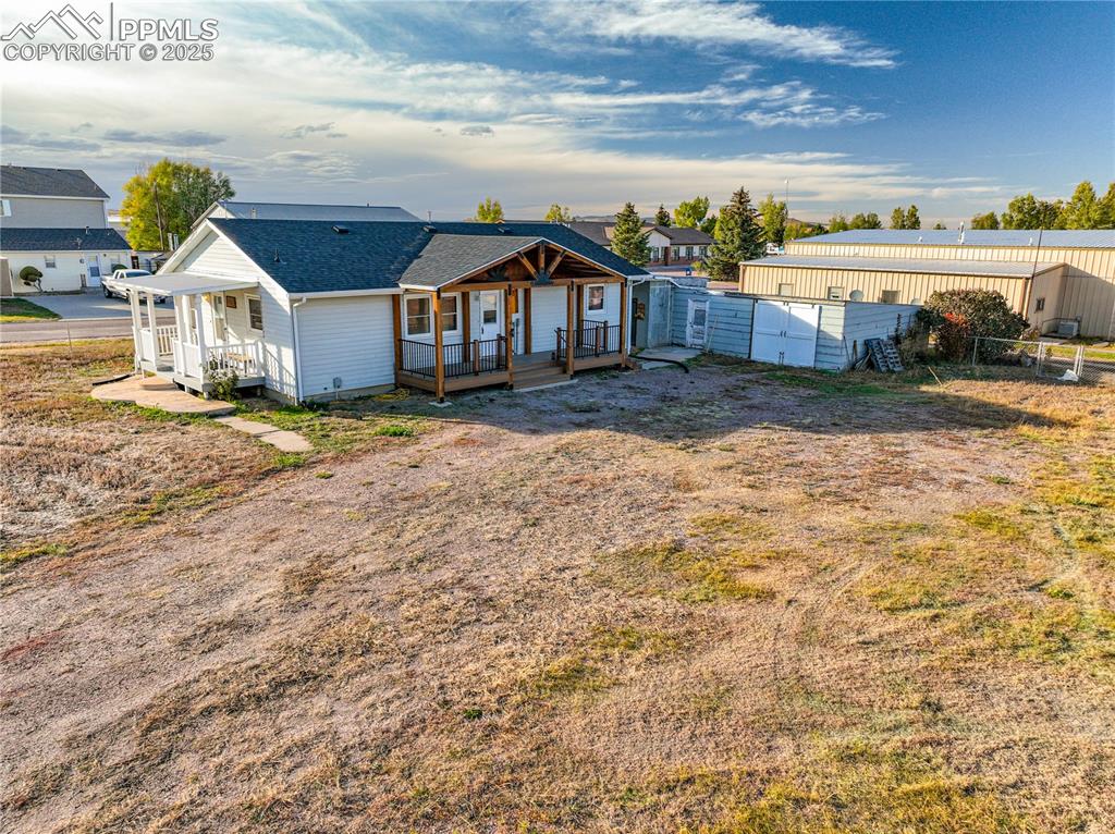 1075 8th Street Calhan, CO 80808 - Photo 1 of 45 a view of a house with a yard