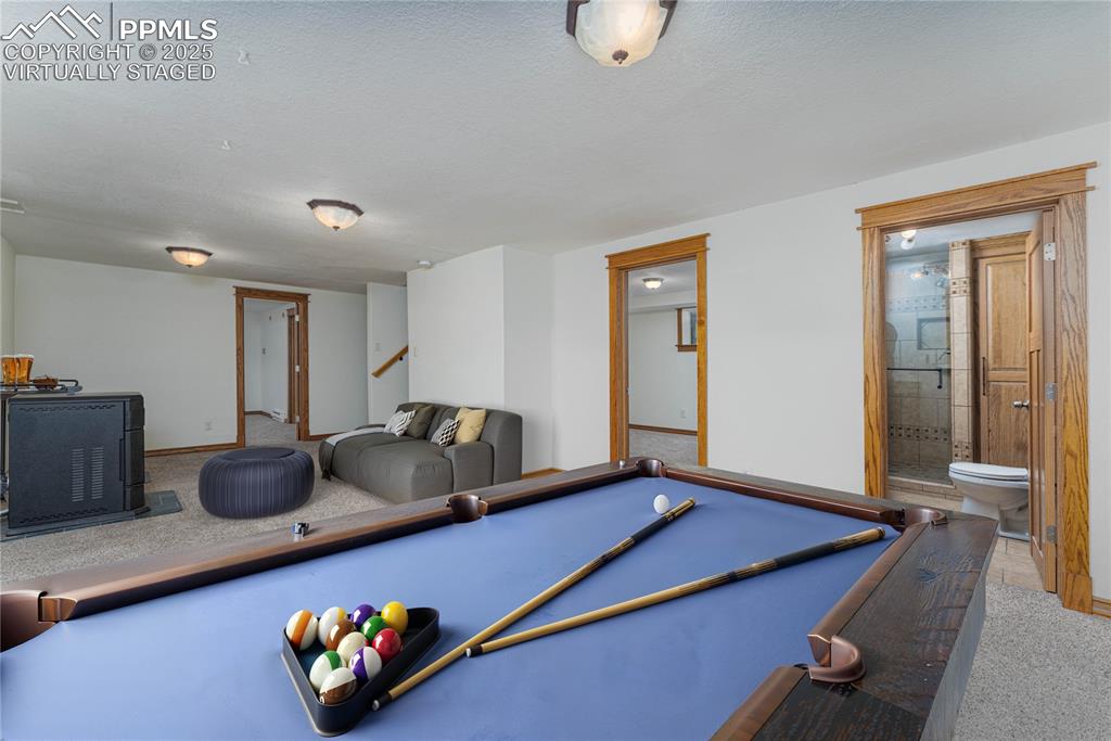 1075 8th Street Calhan, CO 80808 - Photo 17 of 45 a room with furniture and wooden floor