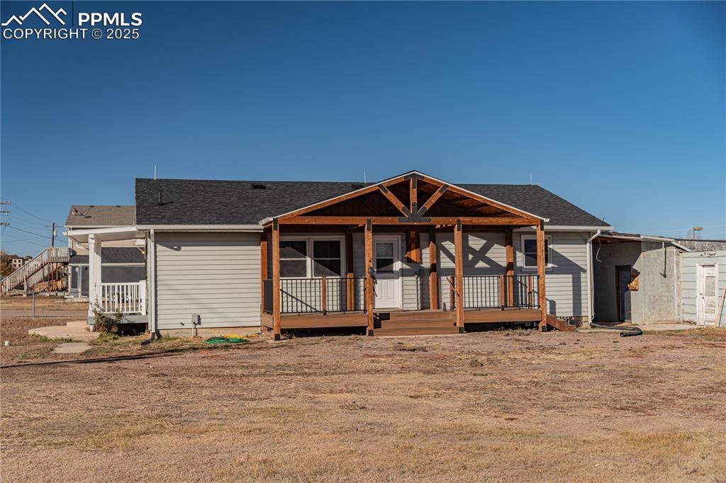 1075 8th Street Calhan, CO 80808 - Photo 26 of 45 a front view of a house with a yard