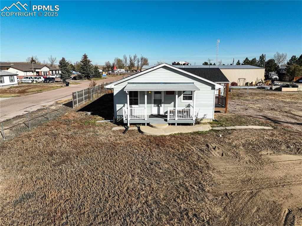 1075 8th Street Calhan, CO 80808 - Photo 34 of 45 a view of a house with a yard