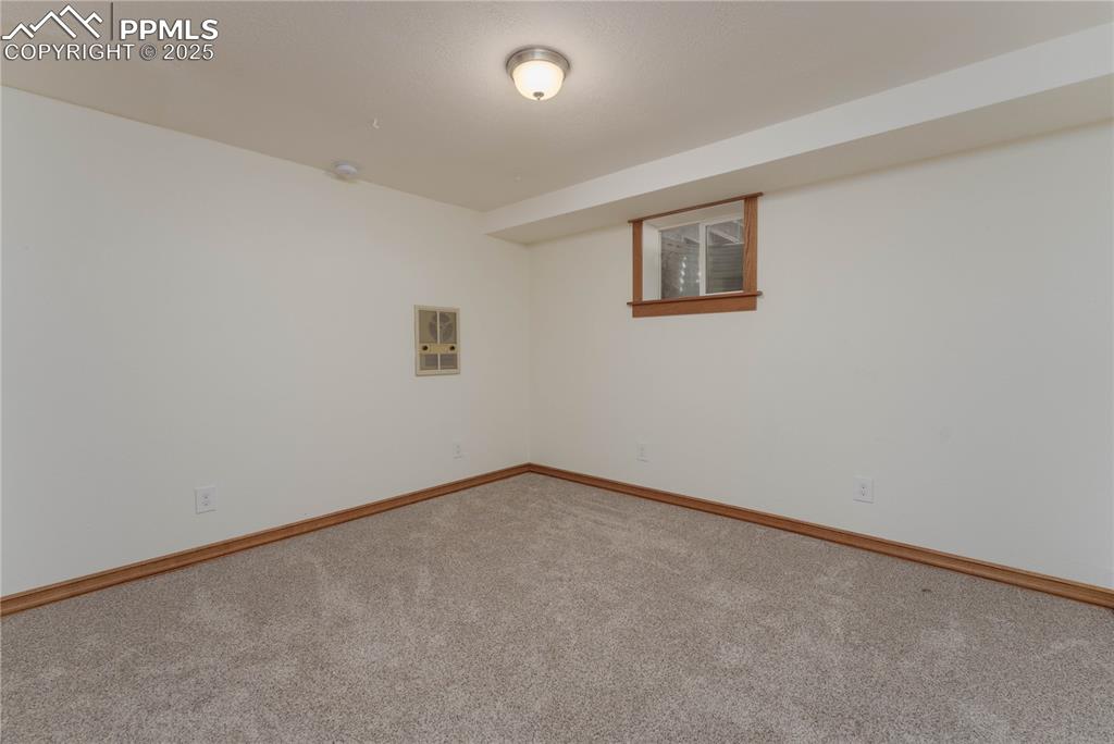 1075 8th Street Calhan, CO 80808 - Photo 44 of 45 an empty room with a empty space and a window
