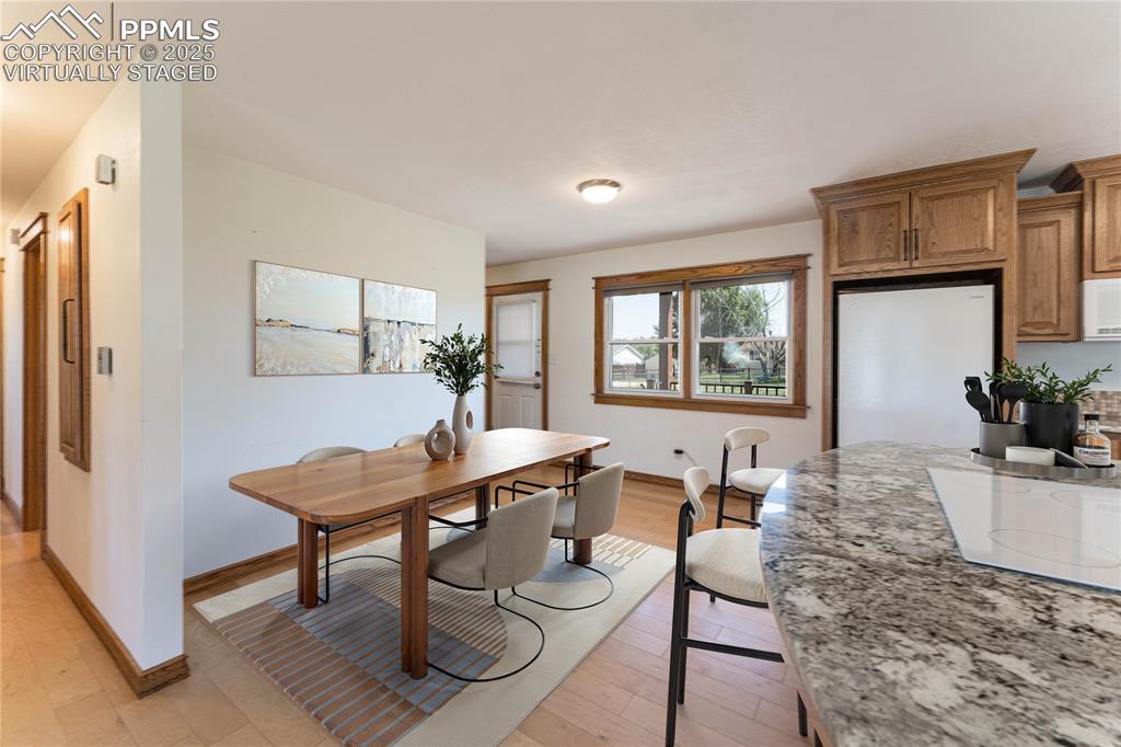1075 8th Street Calhan, CO 80808 - Photo 6 of 45 a living room with furniture a table and a large window
