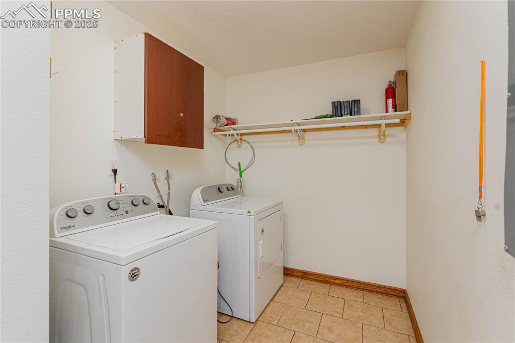 1075 8th Street Calhan, CO 80808 - Photo 8 of 45 a utility room with dryer and washer