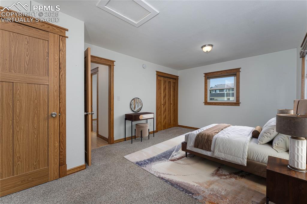 1075 8th Street Calhan, CO 80808 - Photo 9 of 45 a bedroom with bed and a window