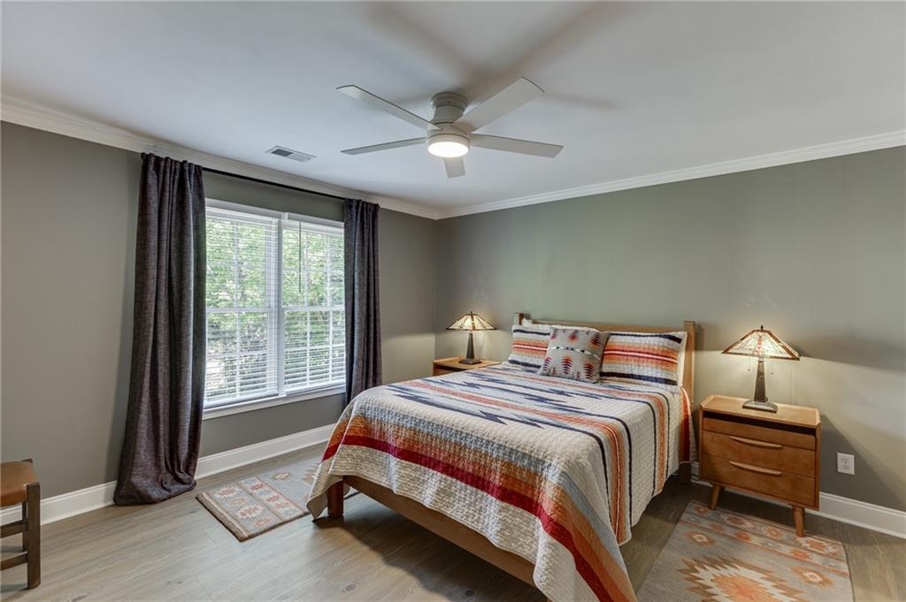 2758 Pathview Drive Dacula, GA 30019 - Photo 25 of 48 a bedroom with a bed and a window