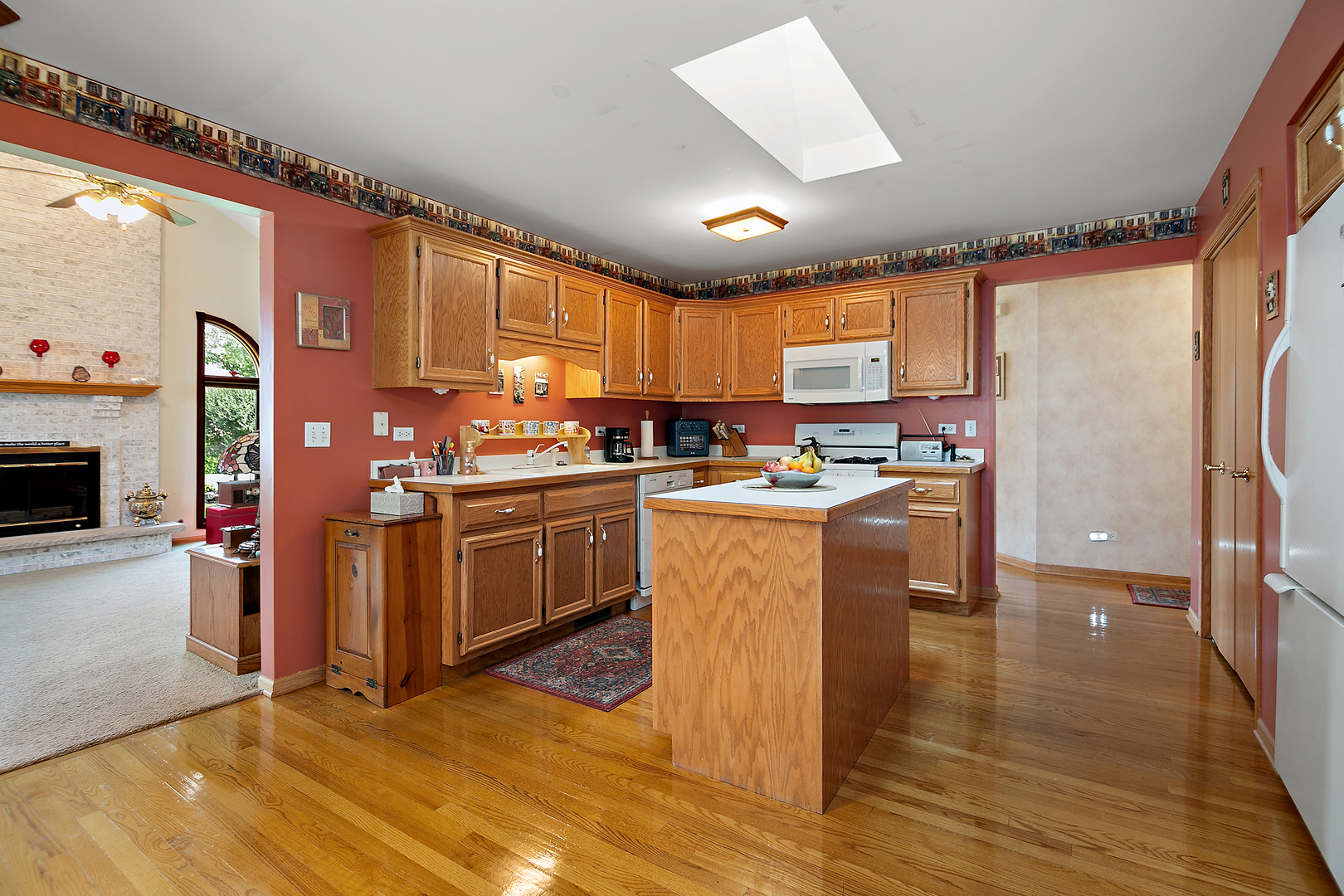 641 Lisson Grove New Lenox, IL 60451 - Photo 13 of 24 a kitchen with stainless steel appliances kitchen island granite countertop a stove top oven a sink a counter top space and cabinets