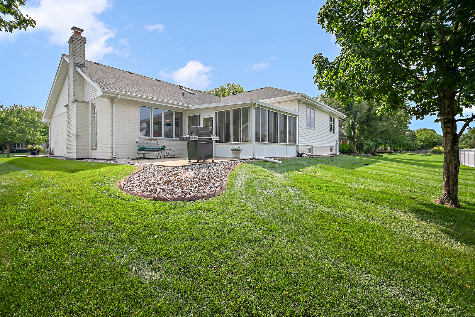 641 Lisson Grove New Lenox, IL 60451 - Photo 3 of 24 a front view of a house with a yard
