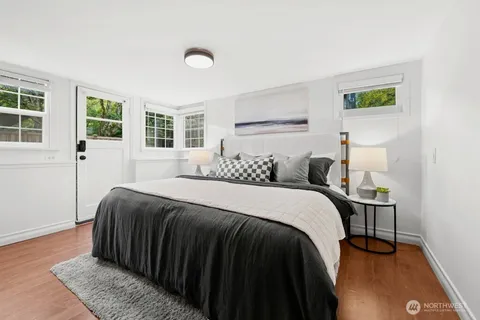 a bedroom with a bed and a window