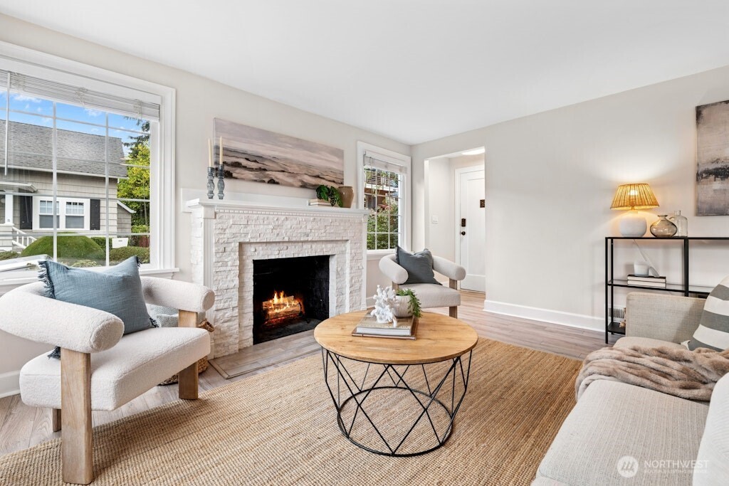 4431 Southwest Kenyon Place Seattle, WA 98136 - Photo 14 of 30 a living room with furniture and a fireplace