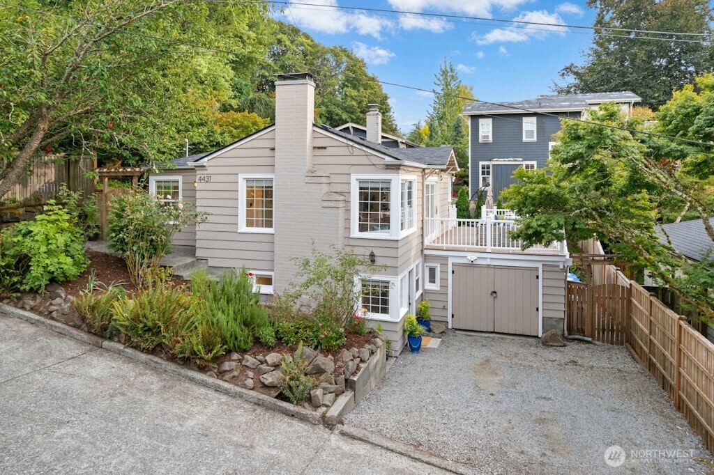 4431 Southwest Kenyon Place Seattle, WA 98136 - Photo 20 of 30 a view of an house with backyard space and garden