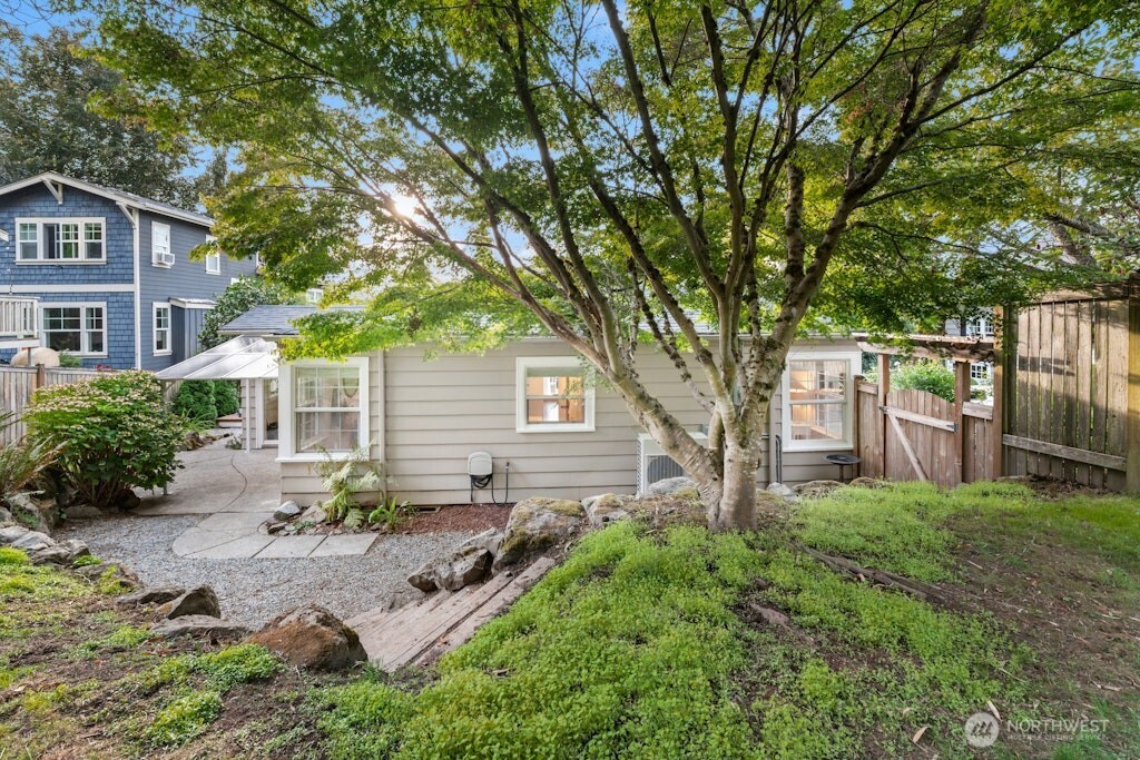 4431 Southwest Kenyon Place Seattle, WA 98136 - Photo 21 of 30 a view of a house with backyard and garden