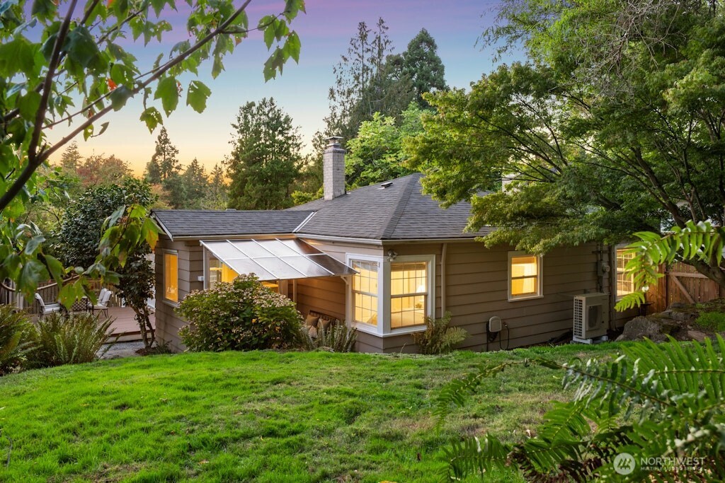 4431 Southwest Kenyon Place Seattle, WA 98136 - Photo 24 of 30 a front view of a house with a garden